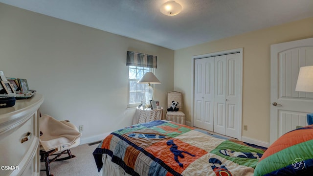 bedroom with carpet floors and a closet