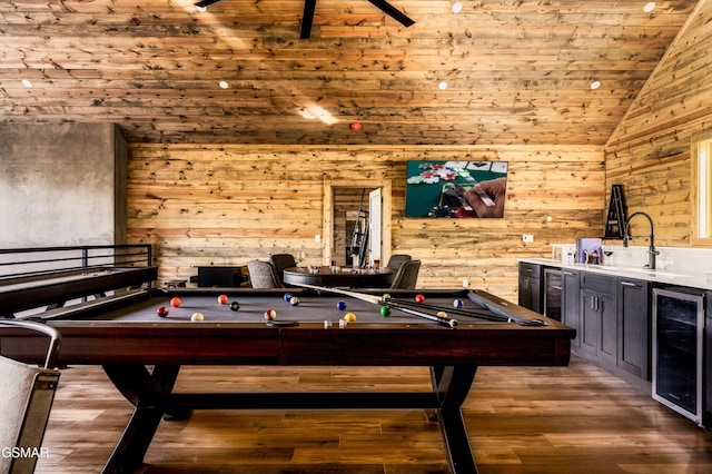 game room featuring lofted ceiling, beverage cooler, wood finished floors, and pool table