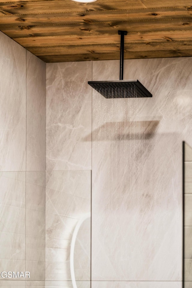 interior details with a shower and wood ceiling