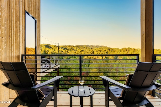 balcony at dusk with a mountain view