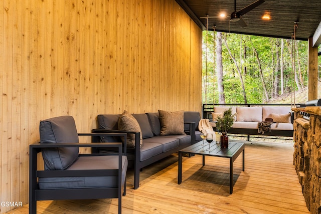 sunroom / solarium with ceiling fan and wooden ceiling