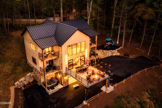 exterior space with a patio area and a balcony