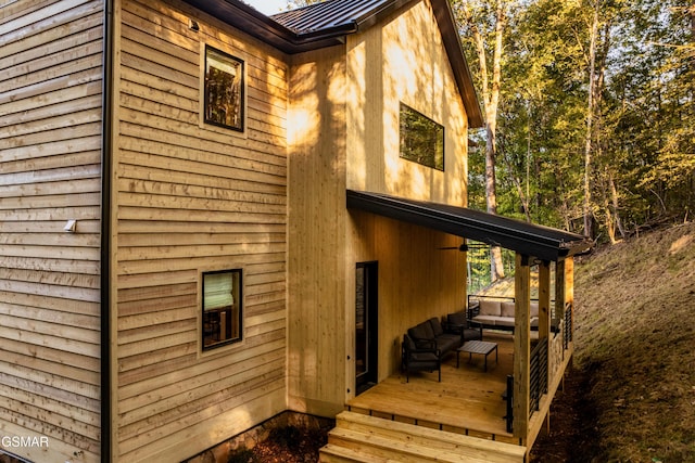 view of side of home featuring metal roof