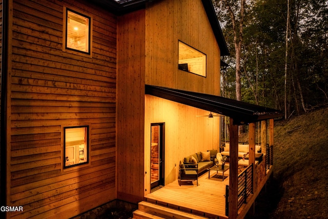 rear view of property with an outdoor hangout area and a deck