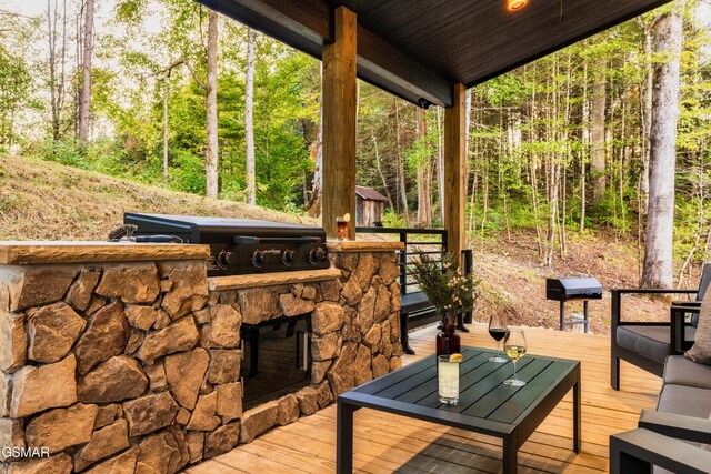 deck featuring area for grilling and exterior kitchen