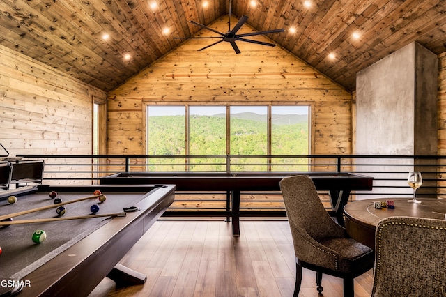 playroom with wood walls, high vaulted ceiling, wood ceiling, and wood-type flooring