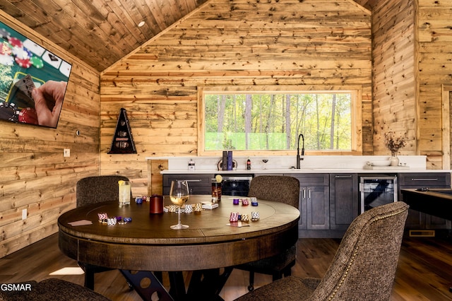 interior space with wood ceiling, beverage cooler, vaulted ceiling, and dark wood-style flooring