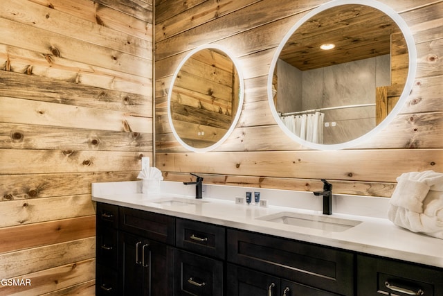 bathroom with vanity and wood walls