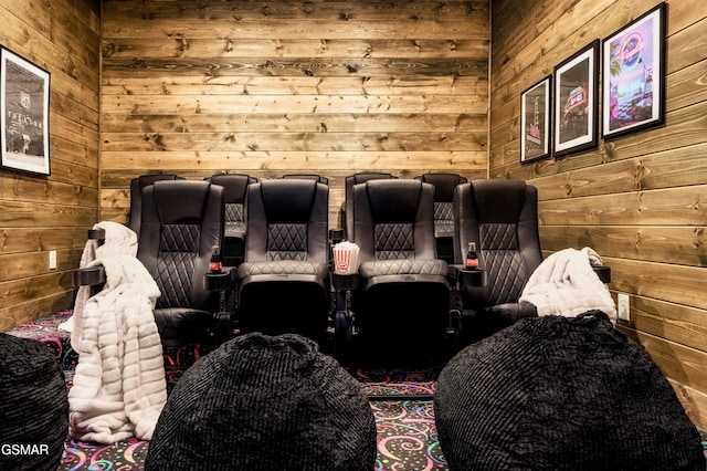 home theater featuring wood walls