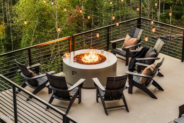 balcony featuring an outdoor fire pit