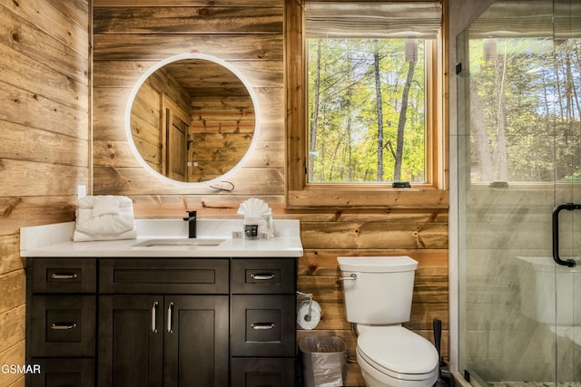 bathroom featuring toilet, an enclosed shower, and wood walls