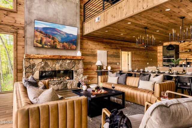 living area featuring a chandelier, wood walls, and wood finished floors