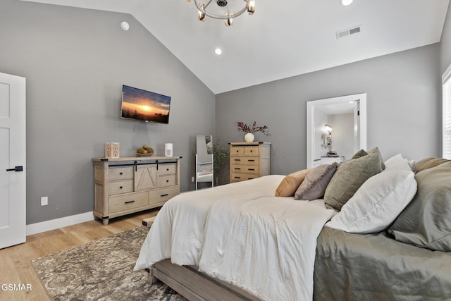 bedroom featuring light wood-style flooring, visible vents, vaulted ceiling, and baseboards