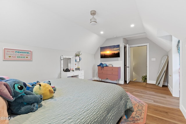 bedroom featuring lofted ceiling, light wood-style flooring, baseboards, and recessed lighting