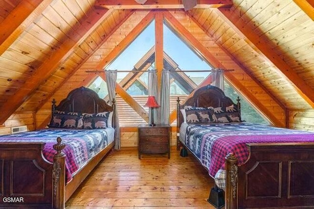 bedroom featuring vaulted ceiling with beams, light hardwood / wood-style floors, and wood ceiling