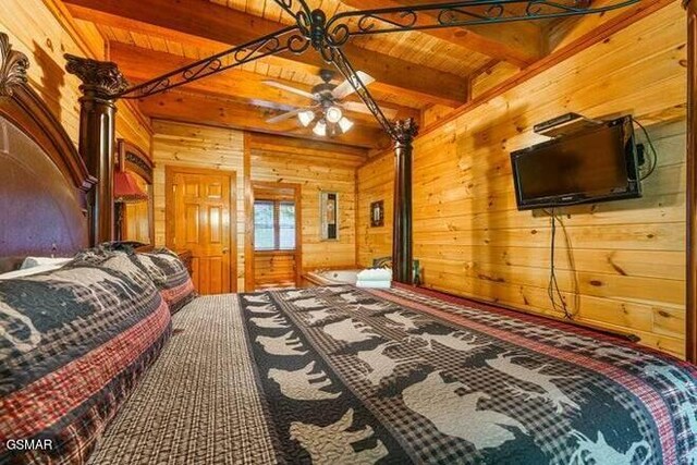 bedroom featuring beamed ceiling, wood ceiling, and wooden walls