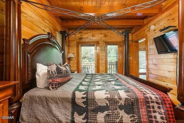 unfurnished bedroom featuring access to outside, wood walls, beamed ceiling, and wooden ceiling