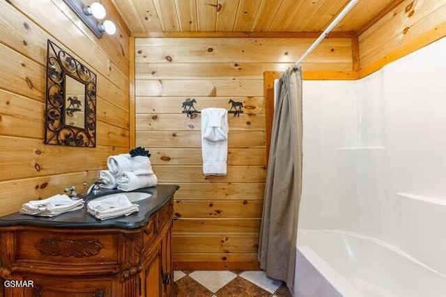 bathroom featuring shower / tub combo, tile patterned floors, vanity, wooden ceiling, and wood walls