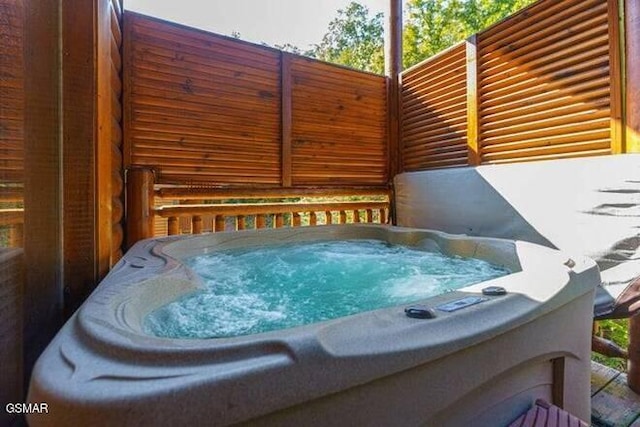 exterior space with a hot tub