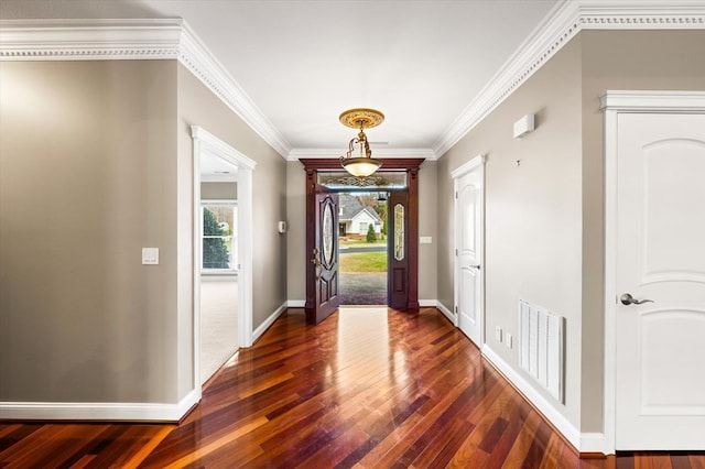 entrance foyer featuring dark hardwood / wood-style flooring and ornamental molding