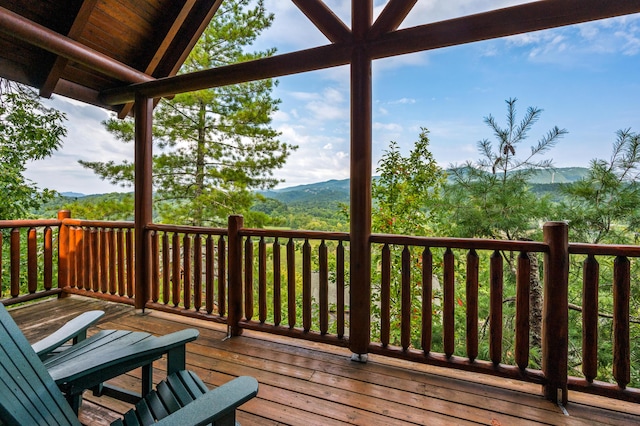 wooden deck featuring a mountain view