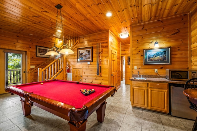 game room with pool table, wooden ceiling, wooden walls, and light tile patterned floors