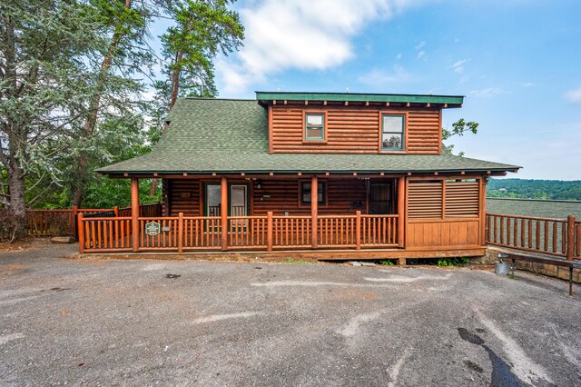 log cabin with a porch