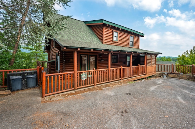 cabin featuring covered porch