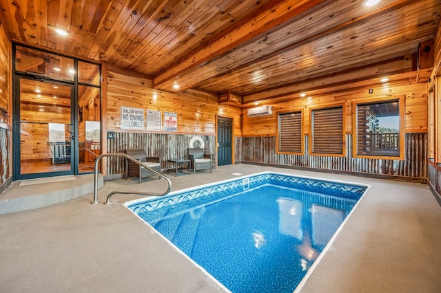 view of pool with a jacuzzi and an AC wall unit