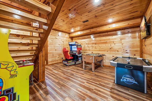 recreation room featuring wood ceiling, hardwood / wood-style flooring, and wood walls