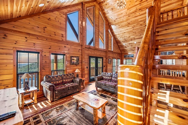 living room featuring high vaulted ceiling, hardwood / wood-style flooring, wooden ceiling, and french doors