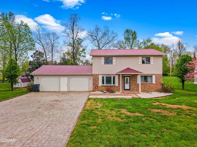 colonial home featuring decorative driveway, metal roof, a front lawn, brick siding, and an attached garage