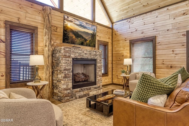 living area with wooden walls, a fireplace, and vaulted ceiling
