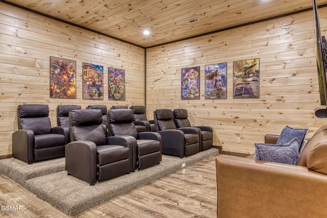 home theater room with wood finished floors, wood ceiling, wooden walls, and recessed lighting