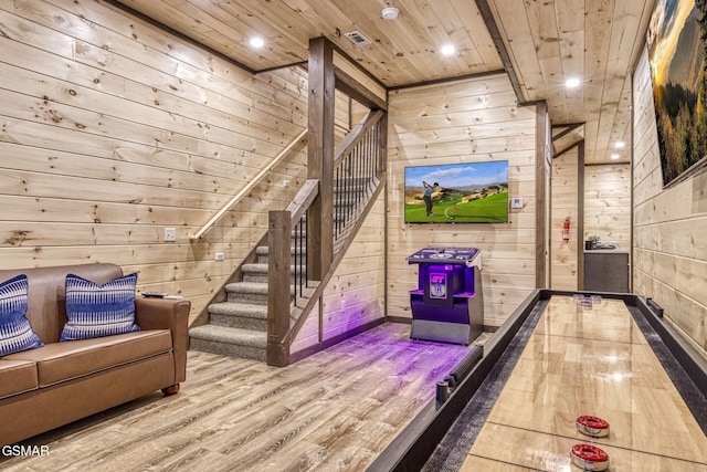 rec room featuring wood walls, wood finished floors, wooden ceiling, and recessed lighting