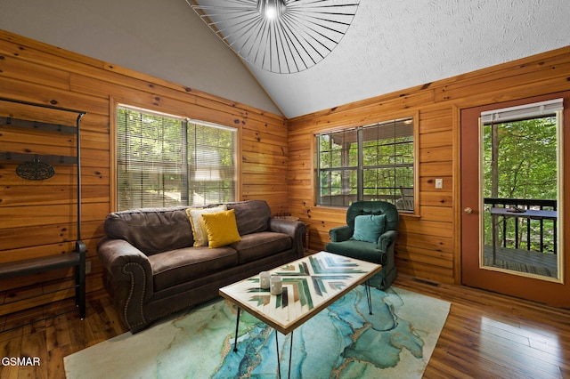 1503 Squirrel Nest Way, Sevierville, TN 37876 - living area with lofted ceiling, wood-type flooring, and wood walls