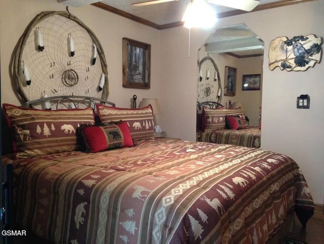 bedroom with ceiling fan and crown molding