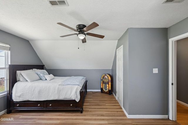 856 Garners Landing Blvd, Seymour, TN 37865 - bedroom featuring wood finished floors, lofted ceiling, and a ceiling fan