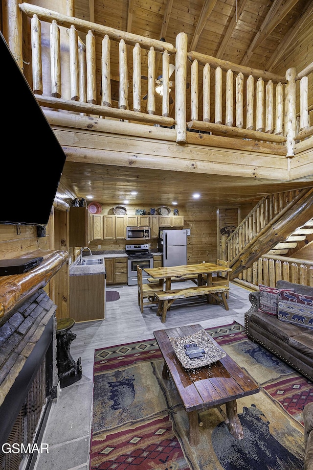 living room with wooden ceiling, high vaulted ceiling, sink, beamed ceiling, and wood-type flooring