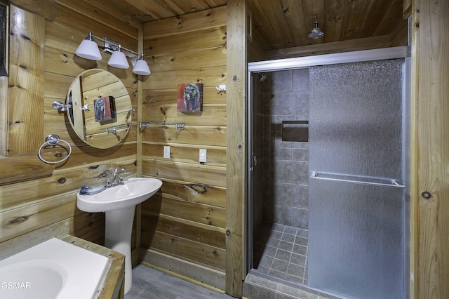 bathroom featuring wooden ceiling and wooden walls