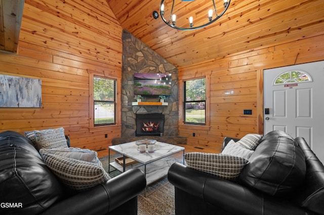 living room featuring a fireplace, high vaulted ceiling, wooden ceiling, and wood walls