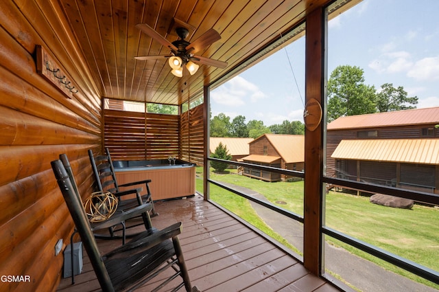 wooden deck featuring ceiling fan