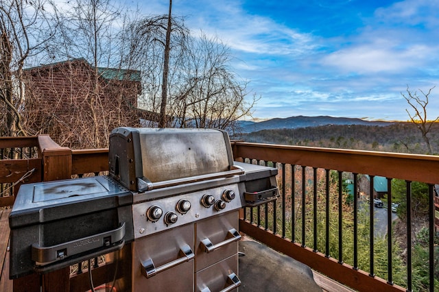 exterior space with a mountain view and an outdoor kitchen