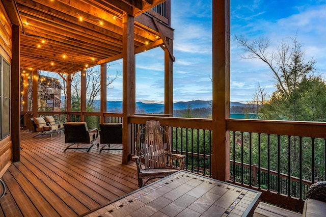 wooden deck featuring a mountain view