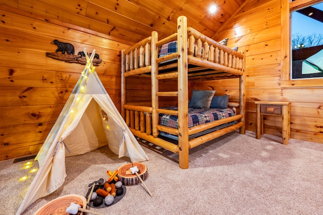 bedroom featuring lofted ceiling, wood ceiling, carpet flooring, and wood walls