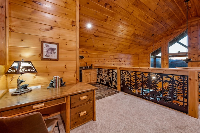 office space with carpet, wooden ceiling, vaulted ceiling, and wooden walls