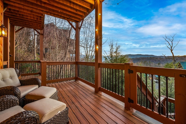 wooden terrace featuring a mountain view