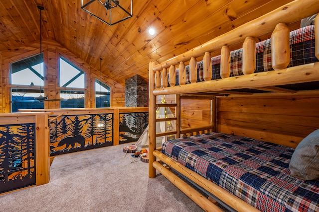 bedroom with carpet floors, wooden ceiling, and vaulted ceiling