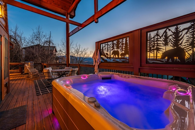 wooden terrace featuring a hot tub