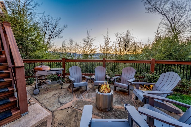 patio terrace at dusk with a fire pit